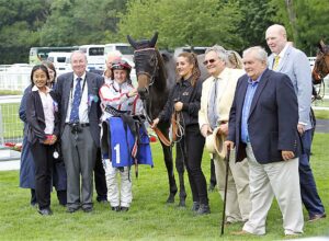 On To Victory and his happy owners in the Winners Enclosure after impressive win.